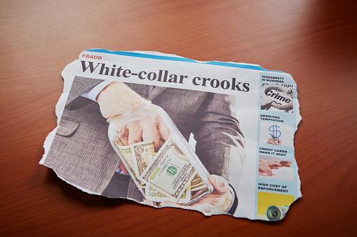 Featured: Newspaper headline White-collar crooks with businessman with hand on money- Embezzlement